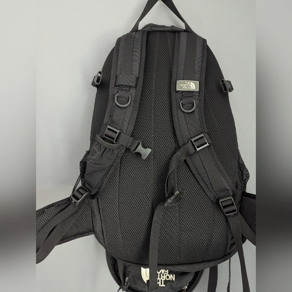The North Face Black Amira Backpack With Adjustable Chest And Waist Straps.